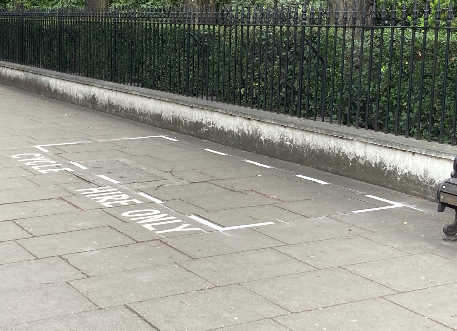 Example of a marked rental e-bike parking bay on the footway