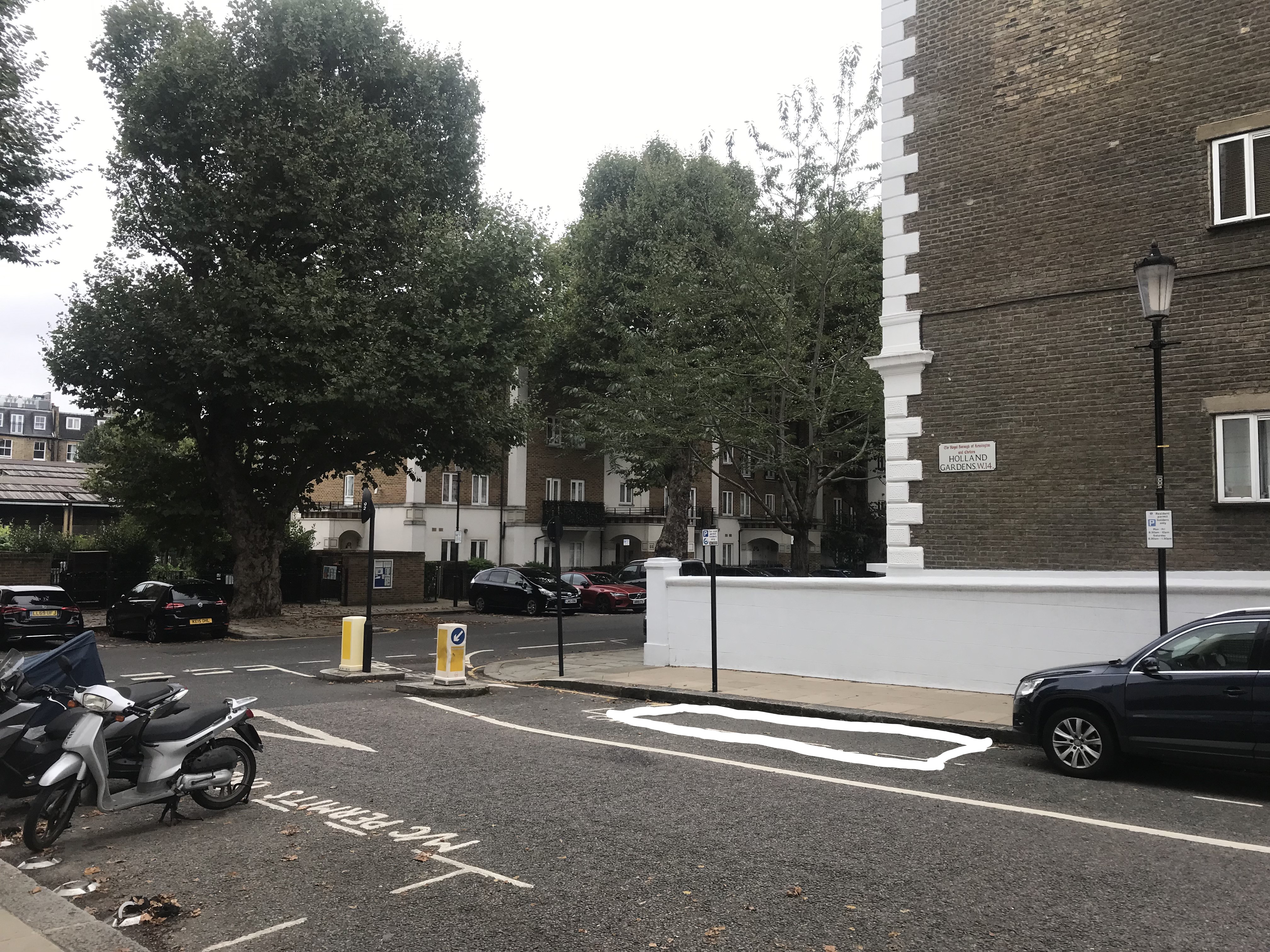 The proposed bay is on the carriageway outside the flank wall of 36 Russell Road, situated in Holland Gardens.