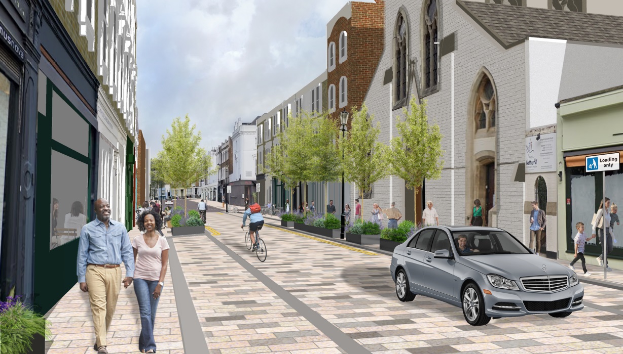 A computer generated visual of how the proposals might look from the Elgin Crescent end of Kensington Park Road.  People are walking and cycling through the street and enjoying the new green areas. A car is being driven southbound.