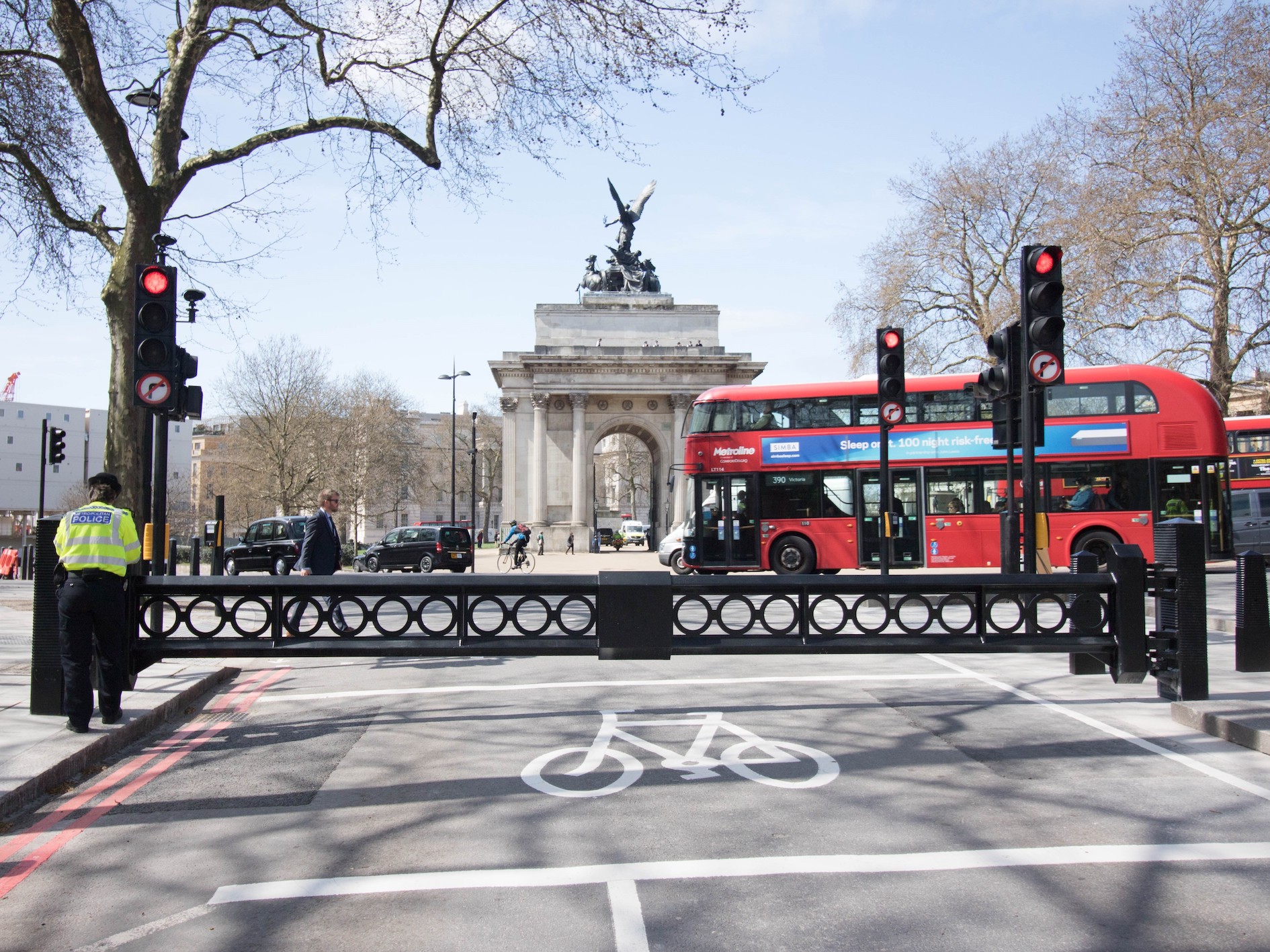 This is a photo of Picadilly Road closed to cars with gates at the forefront and the Wellington Arch in the background. 